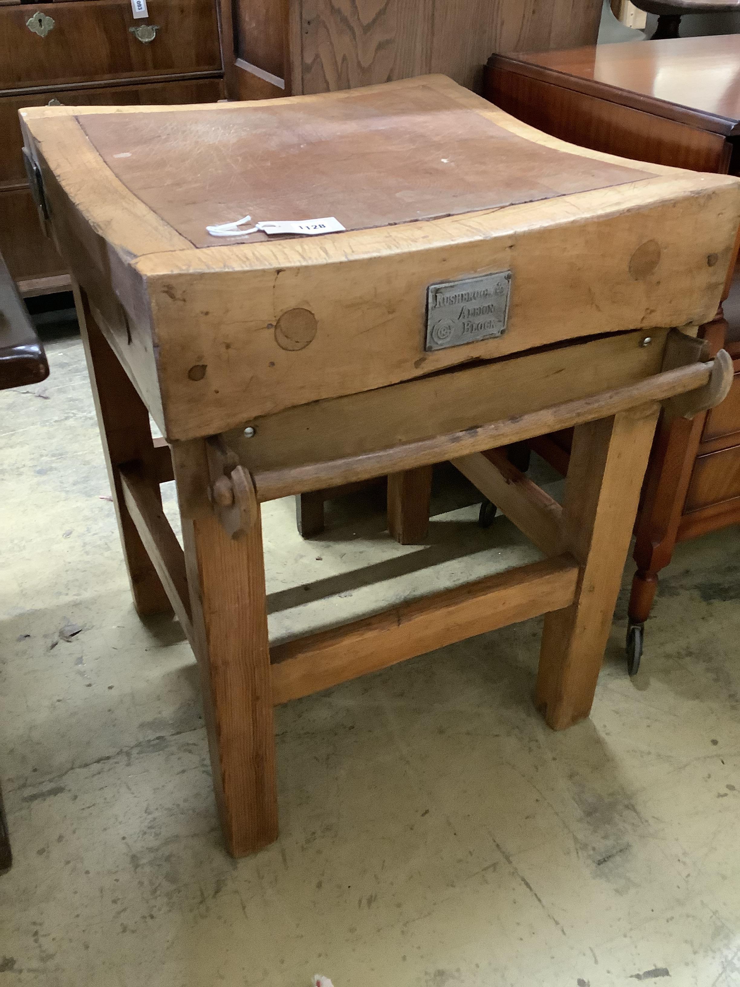 A 'Rushbrookes Albion' butcher's block on pine stand, width 60cm, depth 61cm, height 81cm